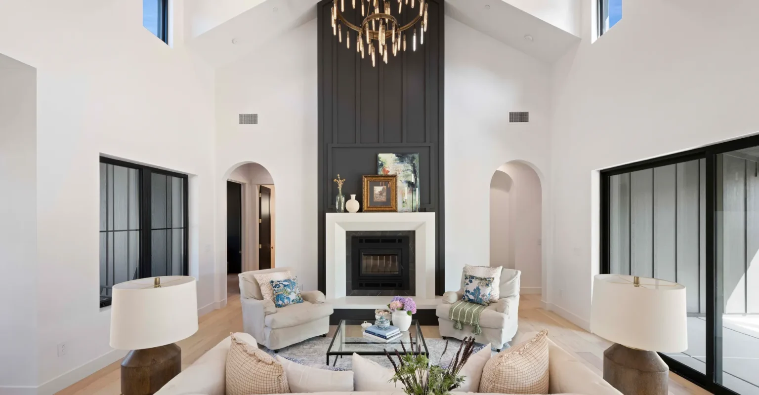 Interior of great room in modern custom home, showing vaulted ceilings and clerestory windows.